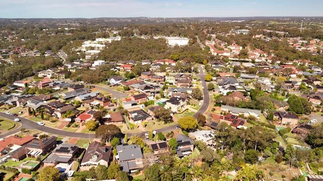 Aerial drone view over Menai, in the Sutherland Shire, South Sydney, NSW Australia heading over Carmarthen Street toward Allison Crescent on a sunny day in September 2026