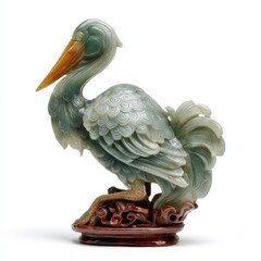 Fototapeta premium Elegant Green Jade Crane Statue Hand Carved With Intricate Detail On A Wooden Base Isolated White