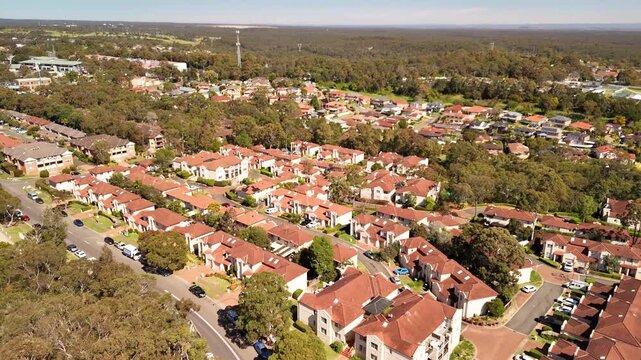 Aerial drone view over Menai, in the Sutherland Shire, South Sydney, NSW Australia heading along Allison Crescent to Menai Road on a sunny day in September 2026