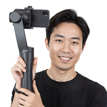 Vlogger gimbal smartphone smiling Asian man holding mobile stabilizer on a transparent background for digital content creation
