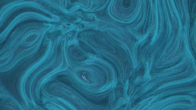Blue liquid marble abstract motion background with swirling paint texture