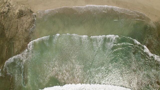 Waves washing over rocky shorelines at Ostional beach in Costa Rica