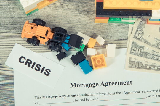 Mortgage agreement form, inscription crisis and money. High prices building or purchase home and crisis on real estate market