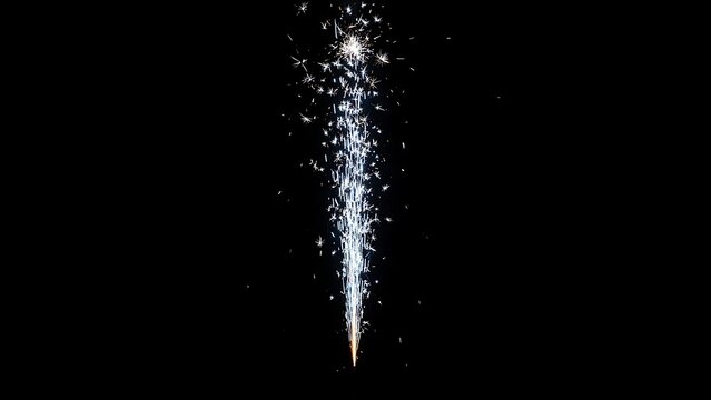 Sparkler fountain fireworks and vertical glowing spark stream with bright silver sparks on solid black background