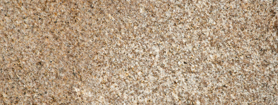 brown granite stone texture close up background speckled rock surface banner