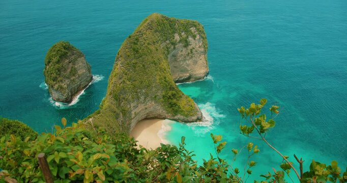 Top down view of secluded sandy beach with clear turquoise ocean water in Nusa Penida Bali Indonesia