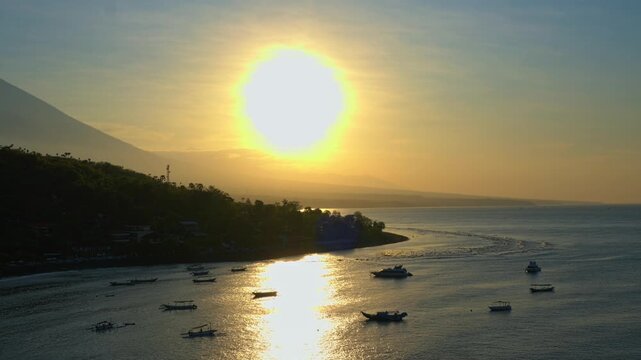 Dramatic Silhouette of Boats Against Intense Morning Sun