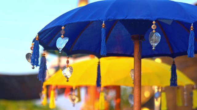 Blue Balinese Temple Umbrella Blowing in the Wind