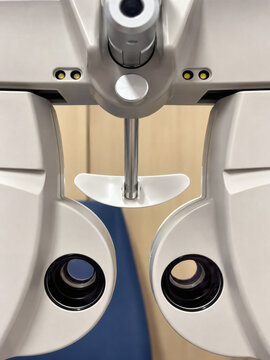 Close-up of autorefractor keratometer equipment used for automated eye refraction and vision examination in ophthalmology clinic