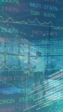 Animation of stock market data processing over spinning windmill against thoughtful businessman
