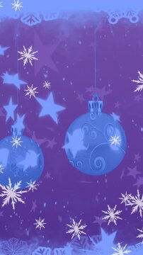 Animation of snow falling over christmas bauble decorations on blue background