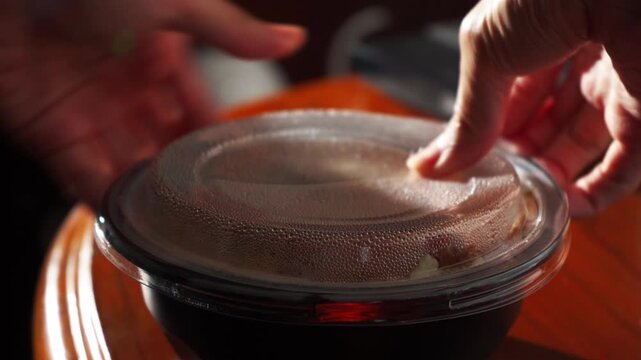 Close Up Shot Opening Lid of Plastic Takeout Container Revealing Hot Fresh Japanese Tonkatsu Pork Cutlet