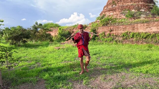 Thai Martial Arts Warrior with Swords at Ayutthaya Ancient Temple Ruins