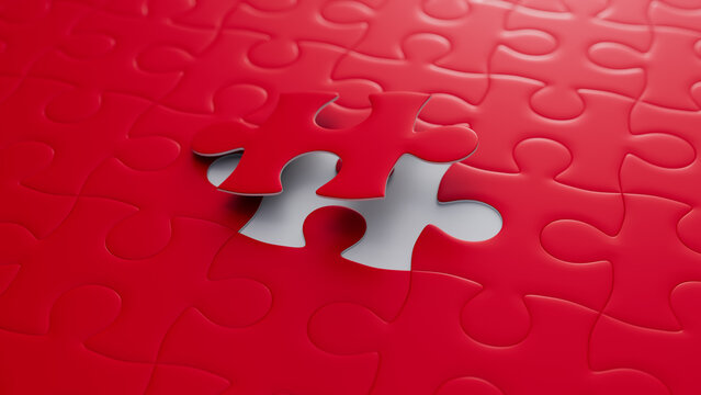 Close up of Red and White Jigsaw Puzzle Background focusing on the last piece to go into place. Perfect Fit Concept.