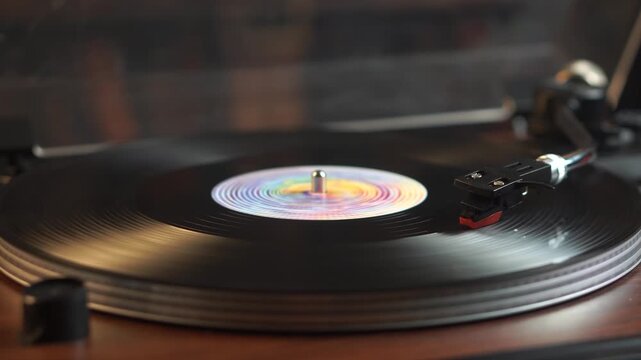 Vinyl record spinning on vintage turntable with colorful center label.