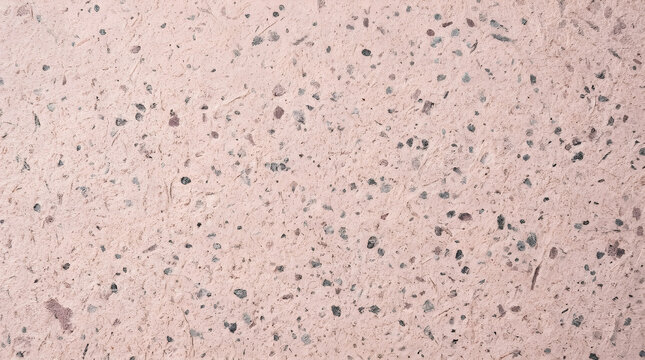 Speckled dot paper texture background in blush pink and grey tones. Grainy irregular spotted noise surface with abstract grain pattern in macro detail.