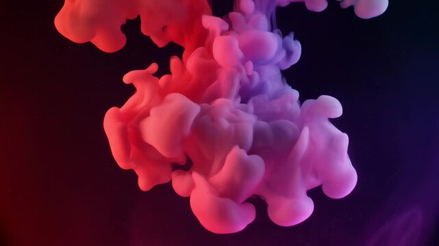 Abstract ink cloud glowing in red purple light