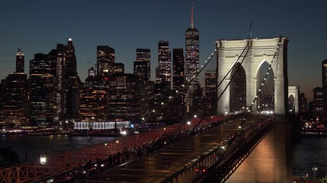 dusk aerial creeping along Brooklyn Bridge towards downtown NYC