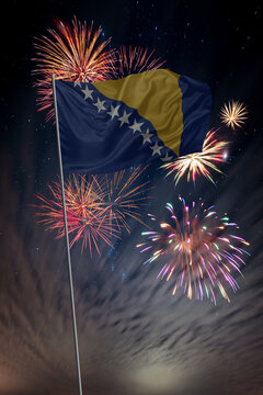 Waving National flag of Bosnia Herzegovina and holiday fireworks in night sky