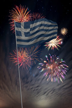 Waving National flag of Greece and holiday fireworks in night sky