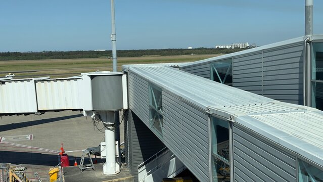 Modern Airport Jet Bridge and Terminal Exterior at Brisbane Airport