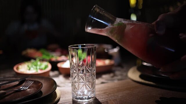 Strawberry lemonade refreshing summer beverage in cafe, cold fruit drink on table of restaurant