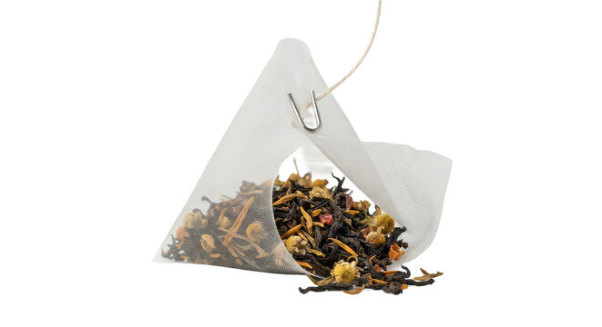 Pyramid tea bag with loose leaf tea isolated on white background