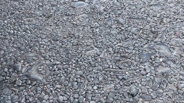 Texture of Broken Asphalt Road Surface Showing Ruined Infrastructure