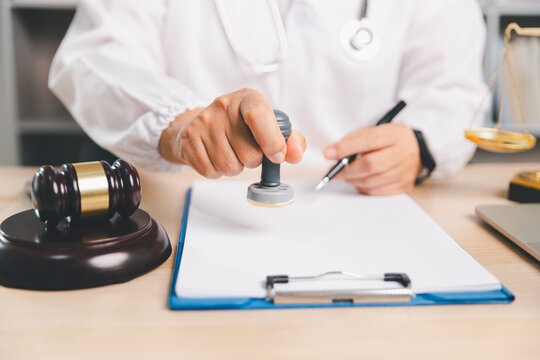 Healthcare compliance concept with doctor stamping a document beside gavel and justice scale, representing medical approval, certification, legal review, regulation, ethics, and authorization.