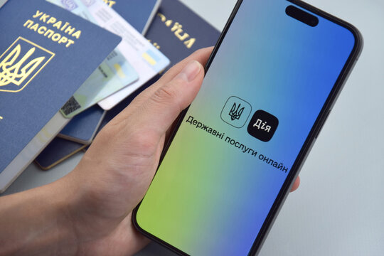 Diia application on the smartphone screen on the blue background.