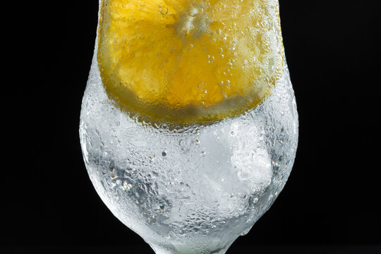 Close Up of Refreshing Sparkling Citrus Drink With Orange Slice and Ice