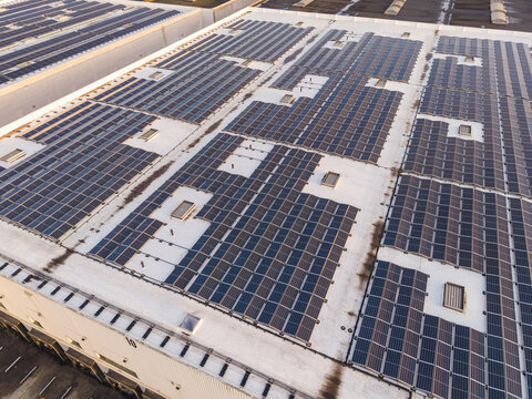 Aerial view of the extensive solar panel installation on the roof of the Cargovil logistics facility in Vilvoorde, Vlaanderen, Belgium.