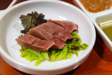 Fototapeta premium Fresh Korean Fermented Skate Liver Hongeo Ae Delicacy on Lettuce