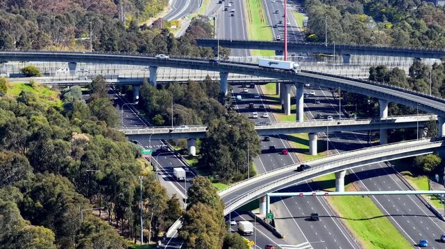 Tele slow panning view of complex busy Light Horse interchange on Motorway M4.