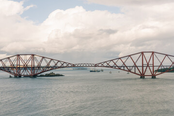 Fototapeta premium Iconic red Forth Bridge railway viaduct spanning the Firth of Forth in Scotland, UK - 4 September 2026.