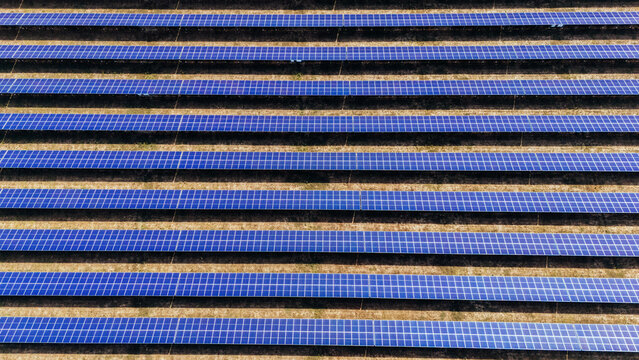 Aerial view of rows of solar panels in a large solar farm in Sabac, Vojvodina, Serbia.