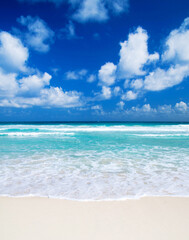 Beach and beautiful tropical sea. Blue sky and white clouds. © Pakhnyushchyy