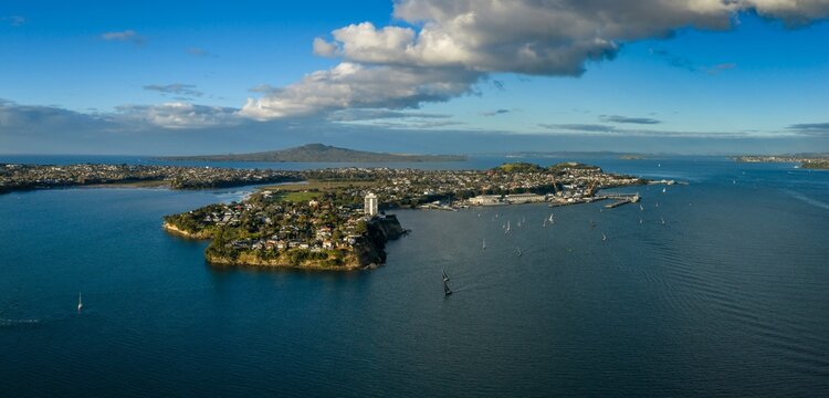 Aerial view of sailboats navigating Waitemata Harbour near Devonport, with Rangitoto Island in the background, Auckland, New Zealand.
