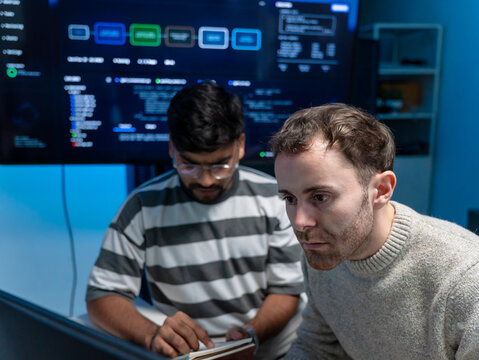 Software engineering use computer working develop AI office are assisting algorithm systems or verifying code. Programmer teamwork using artificial intelligence on laptop analysis or writing coding