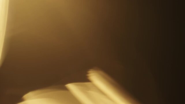 Slow motion real lens flare from back sunlight over dark background for overlay