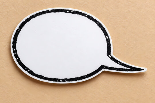 White blank oval speech bubble with a rough black outline and long right-pointing tail on a beige background, styled as a paper cutout comic chat icon with empty space for text