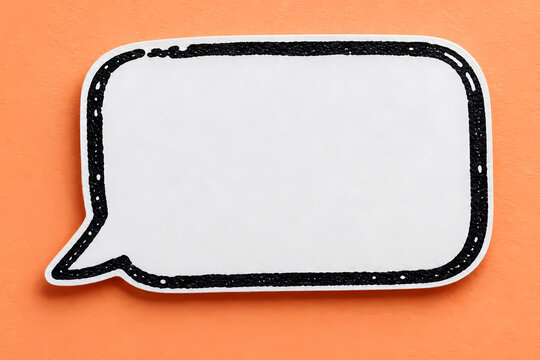 White blank rectangular speech bubble with rounded corners and a rough black outline on an orange background, styled as a paper cutout comic chat icon with empty message space