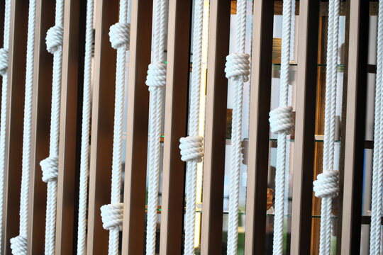 Nautical rope knots creating abstract room divider pattern