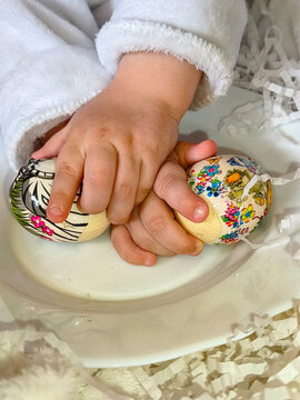 child hands with easter eggs