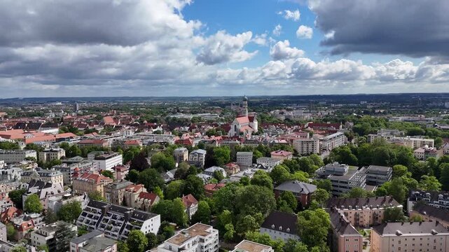 Aerial drone panorama view over historical city center of Augsburg in Germany during sunny summer day.