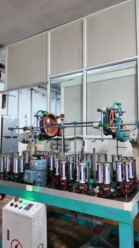 Textile manufacturing machinery in a modern factory in Noida, Uttar Pradesh, India.
