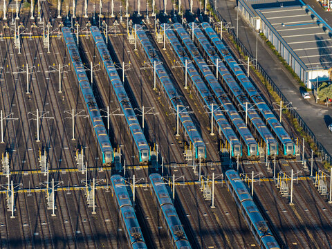 Aerial view of the Sydney Metro stabling yard with rows of driverless trains parked on parallel tracks and overhead electrification infrastructure in Tallawong, New South Wales, Australia.