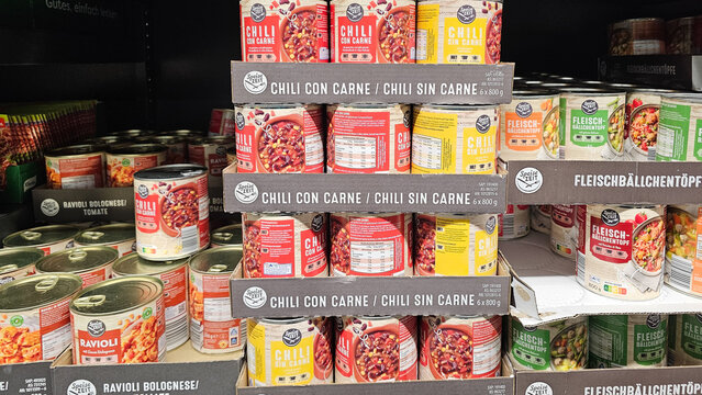 Canned food products displaying chili con carne and ravioli