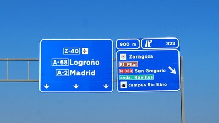 A road sign on the A-2 motorway in Spain, indicating the directions to Logroño and Madrid and exit 323 to Zaragoza and San Gregorio.September 02, 2026 © GenadiyGM