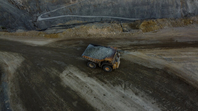 Aerial view of a large haul truck loaded with ore driving through the open-pit copper mine at the RTB Bor Grupa - Rudnik Bakra Majdanpek facility, Majdanpek, Borski okrug, Serbia.
